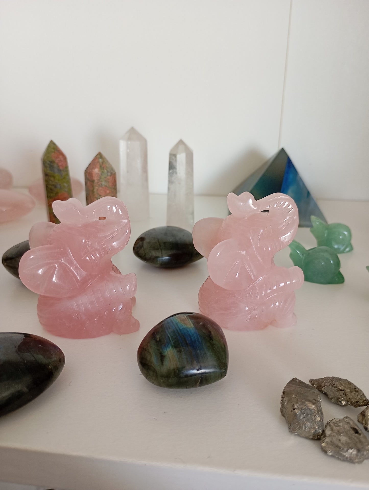 Rose quartz elephant carvings.
