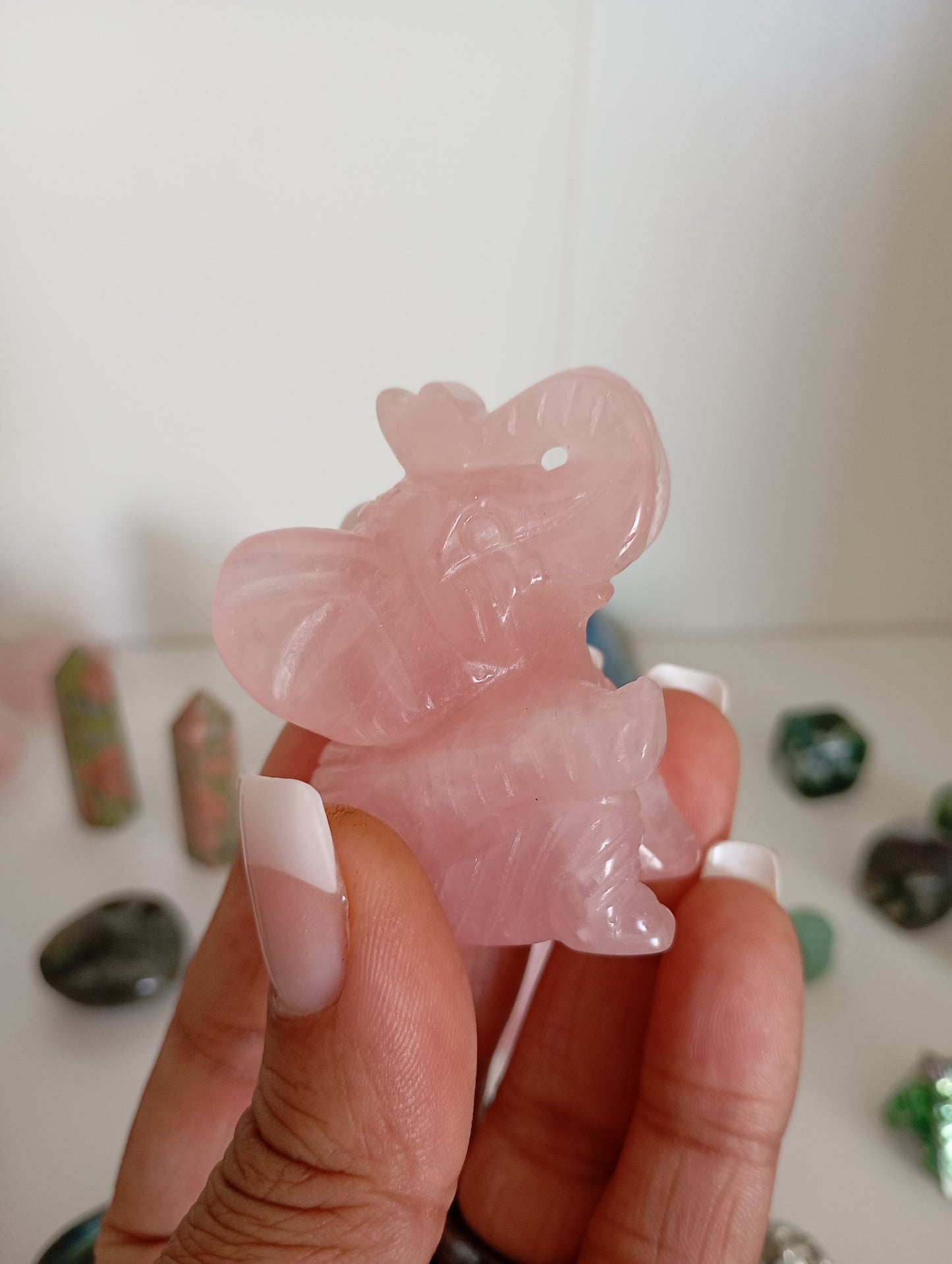 Rose quartz elephant carvings.