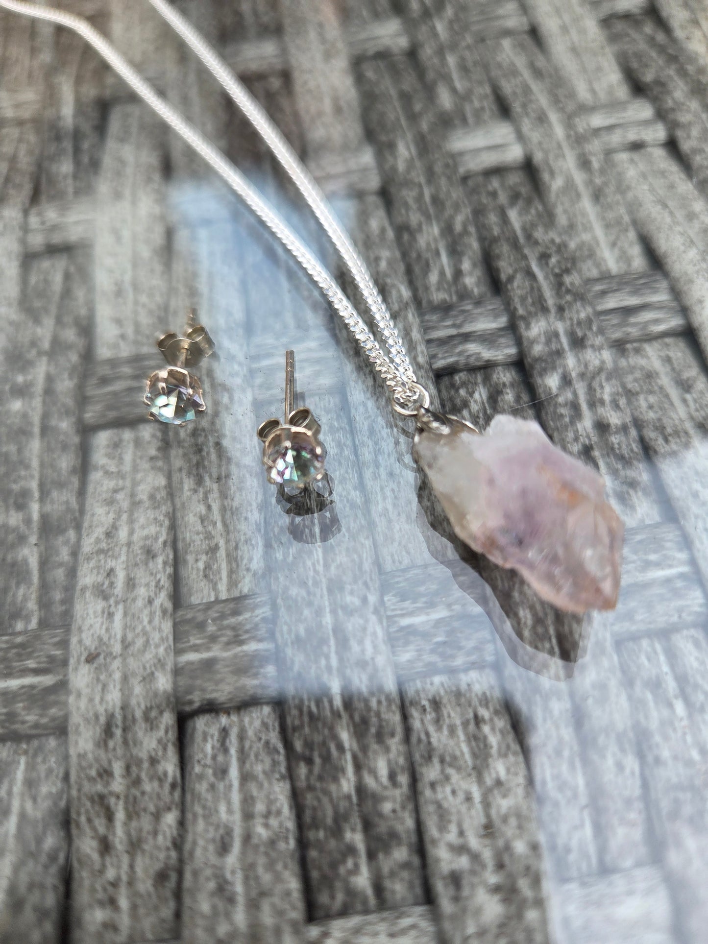 Handmade Raw Amethyst pendant 925 sterling silver chain.
Austrian crystal 925 sterling silver studs.