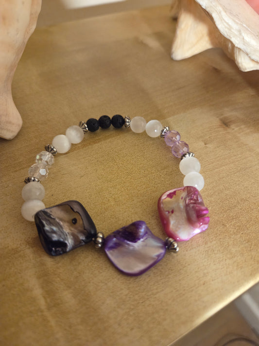 Mother of pearl,  selenite and lava stone.