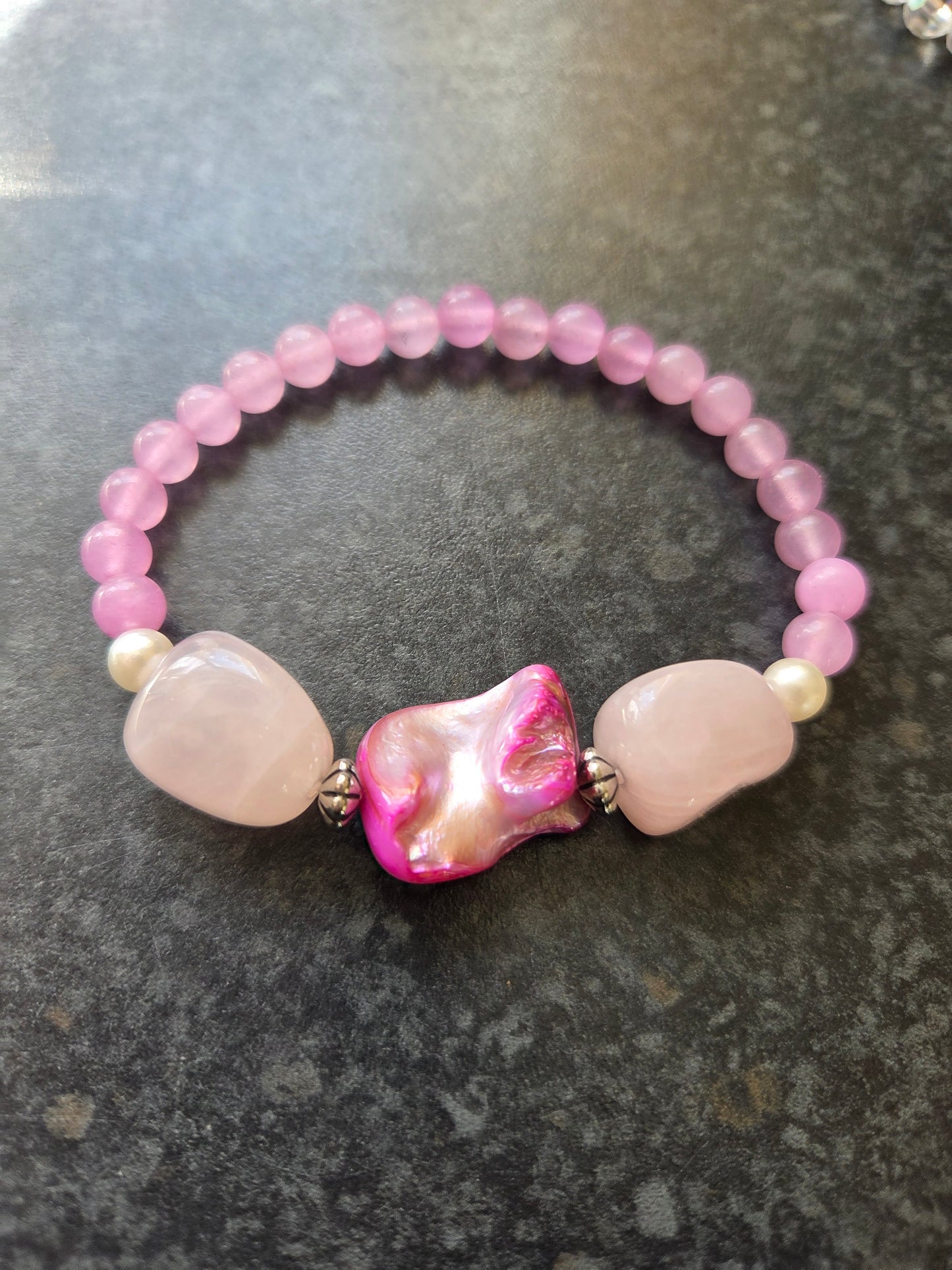 Mother of pearl and rose quartz bracelets.