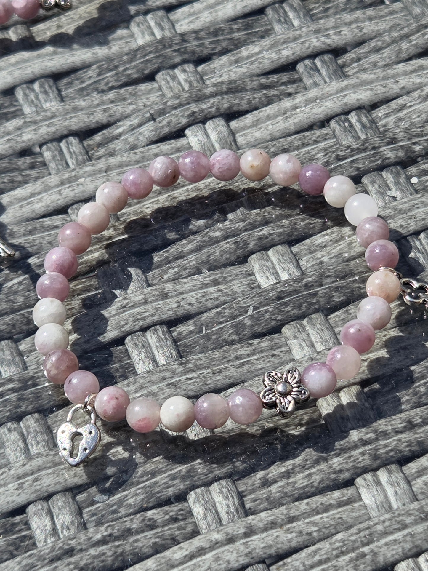Pink tourmaline bracelet with lock and key charm.