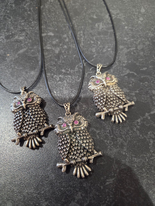 Owl pendant with ruby eyes.