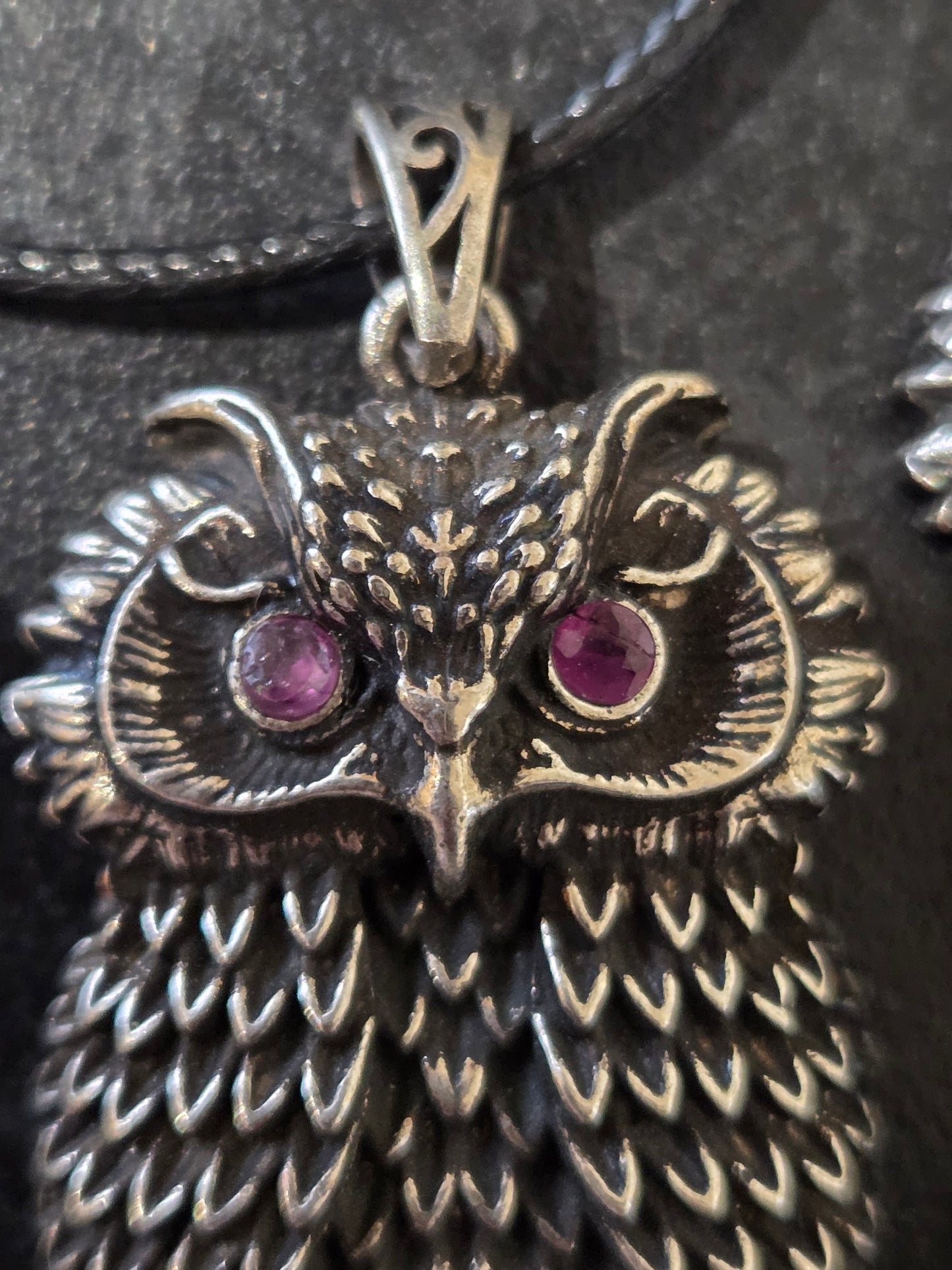 Owl pendant with ruby eyes.