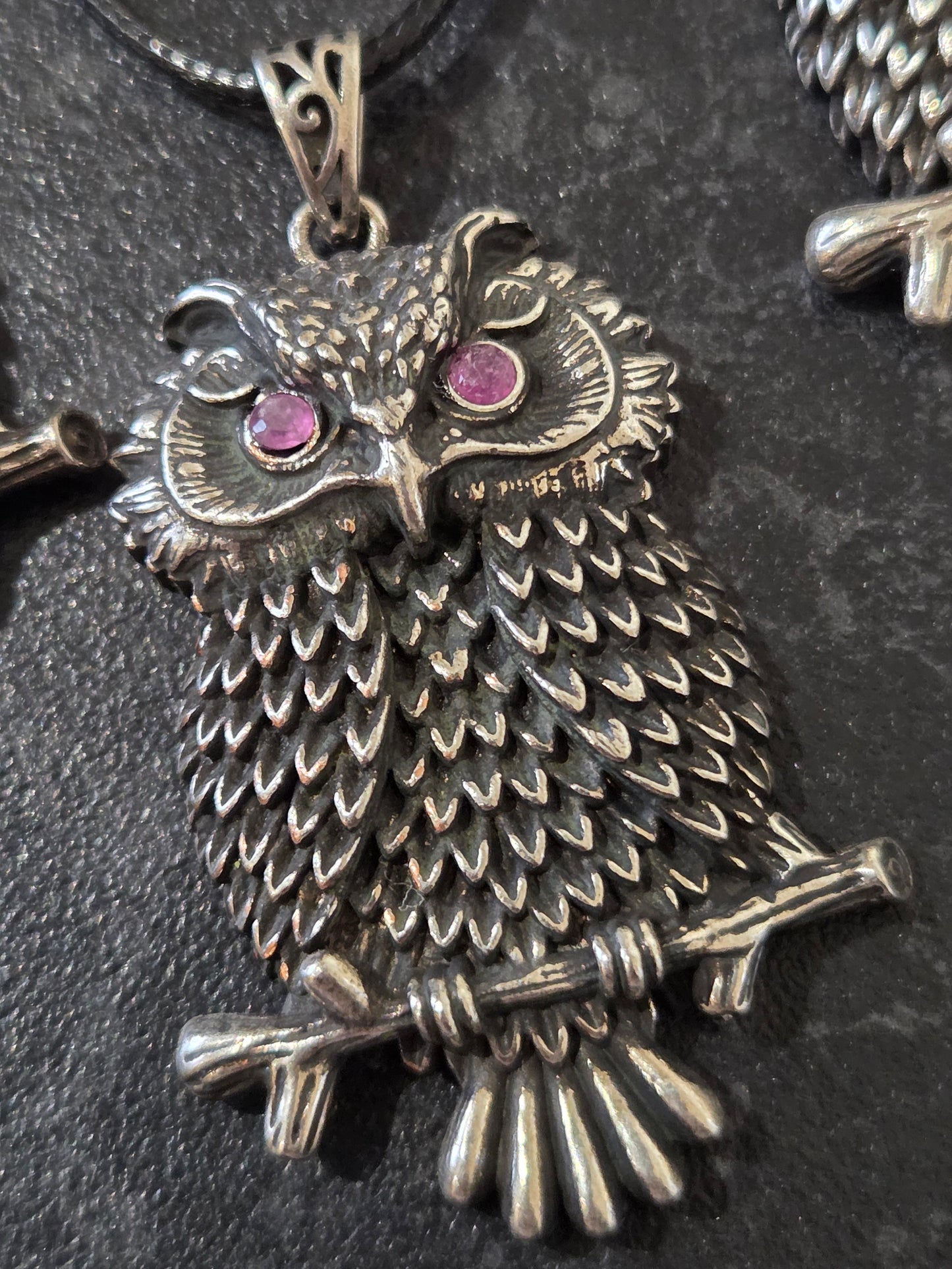 Owl pendant with ruby eyes.