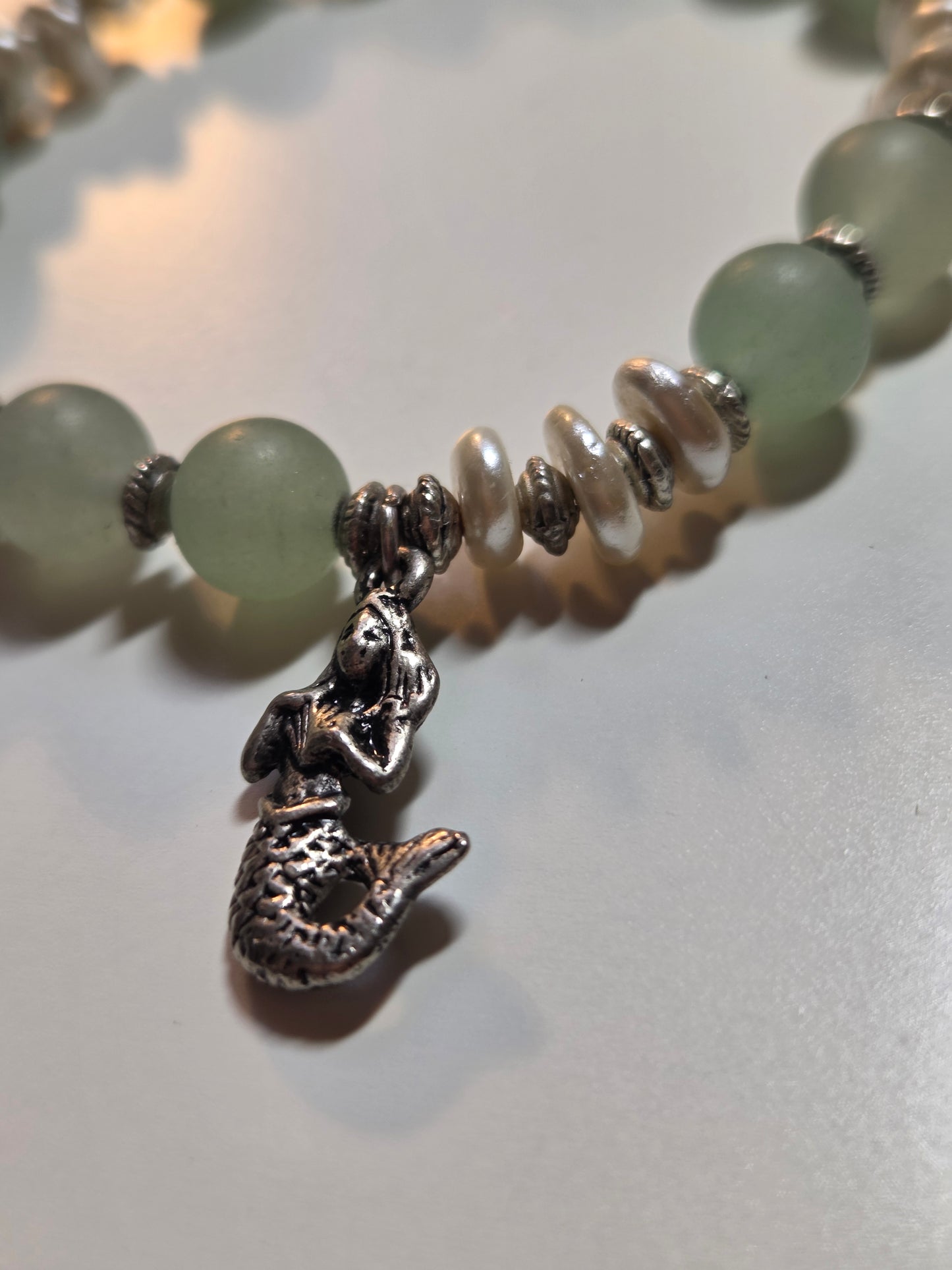 Green aventurine and fresh water pearl with mermaid charm.